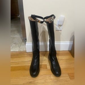 Black shiny boots with belt detail